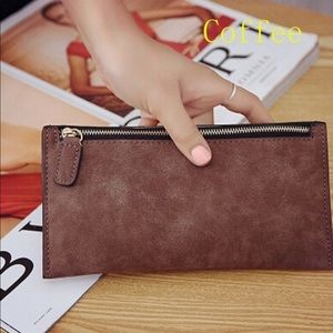 Woman’s faux leather zip wallet.